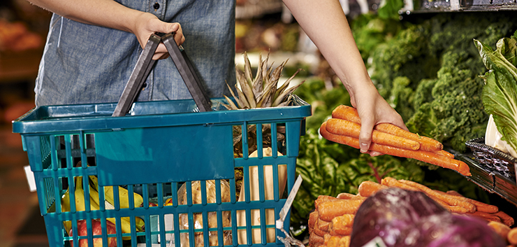 a woman shopping at a grocery store