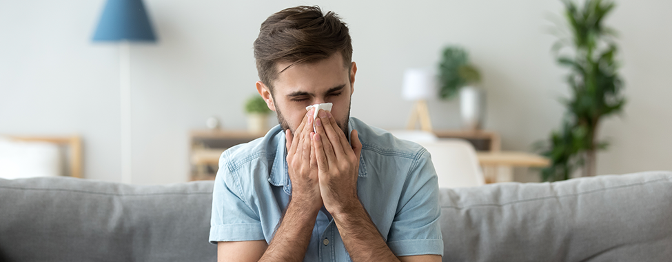 Man-Sneezing-Due-to-Sickness