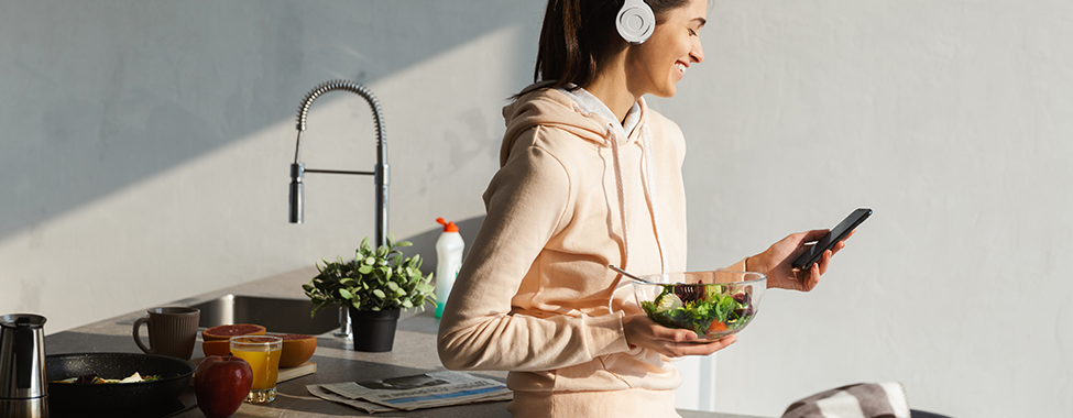 Woman-Laughing-and-Listening-to-Nutrition-Podcasts