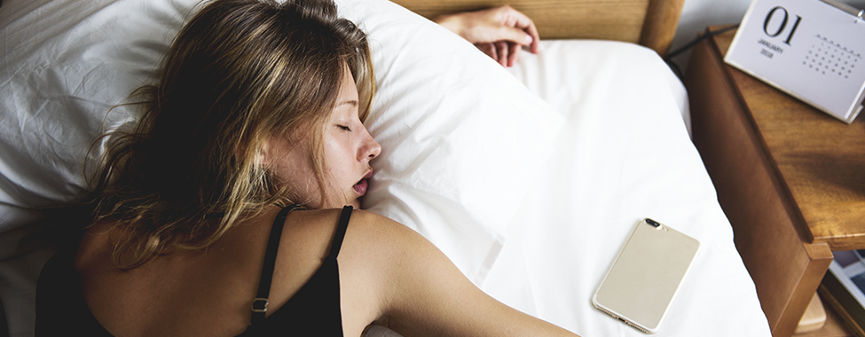 Woman-Sleeping-in-on-New-Years-Day