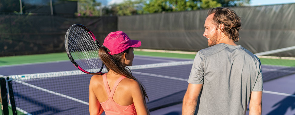 Friends Playing Tennis in Spring for Outdoor Workouts