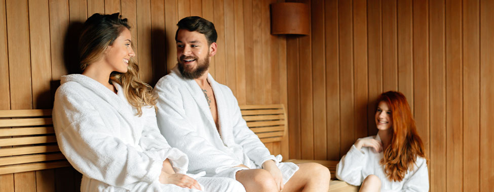 Friends Using Infrared Sauna for HSP Heat Therapy